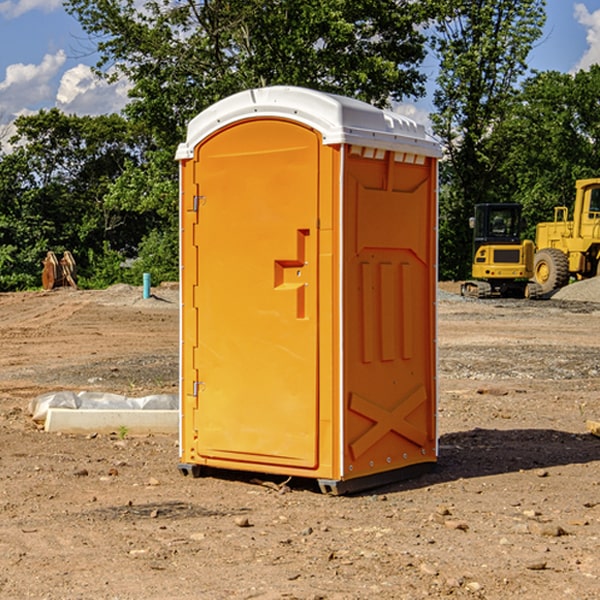 what is the cost difference between standard and deluxe portable restroom rentals in Giles County